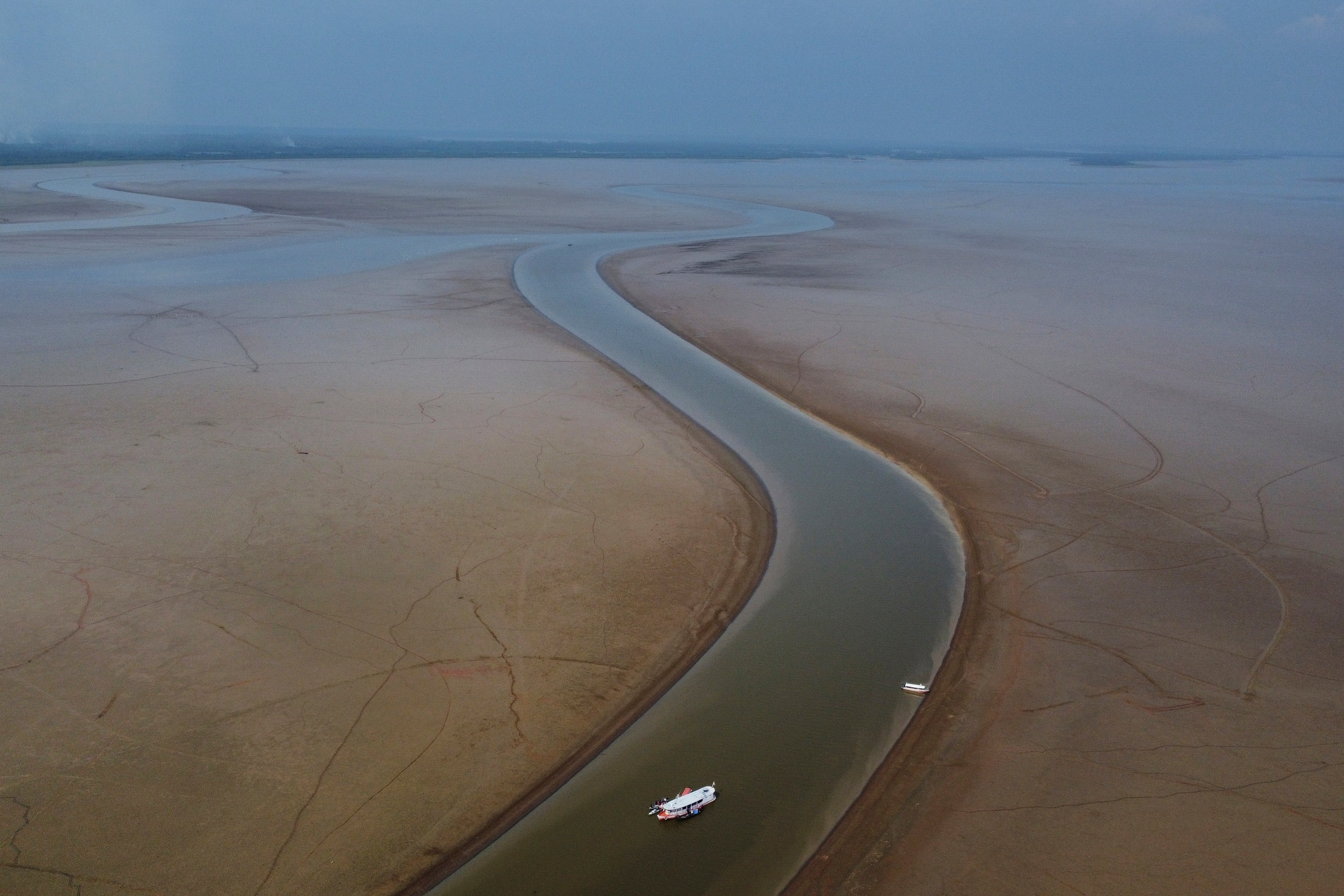 A boat travels through a section of the Amazon hit by drought in the state of Amazonas, near Manacapuru, Brazil