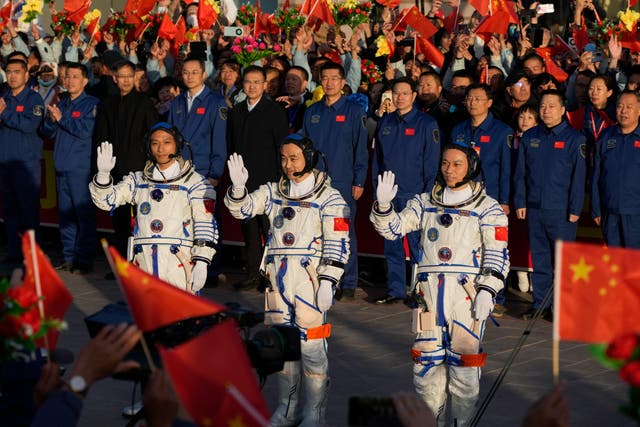 <p>Chinese astronauts for the Shenzhou-17 mission, from left, Jiang Xinlin, Tang Hongbo and Tang Shengjie wave as they attend a send-off ceremony</p>