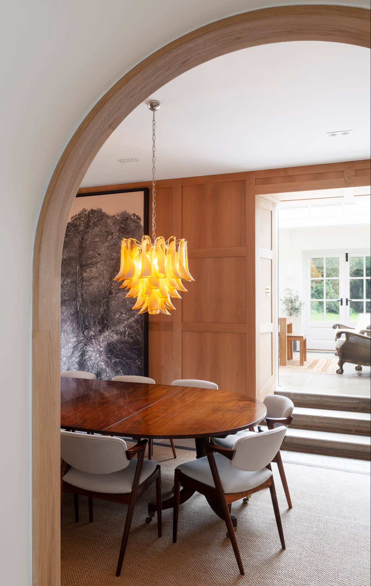 Experts recommend pairing dramatic pendants, such as this one, with statement table lamps