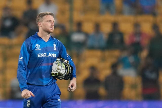 <p>Jos Buttler looks on after England suffer another heavy defeat in the World Cup </p>