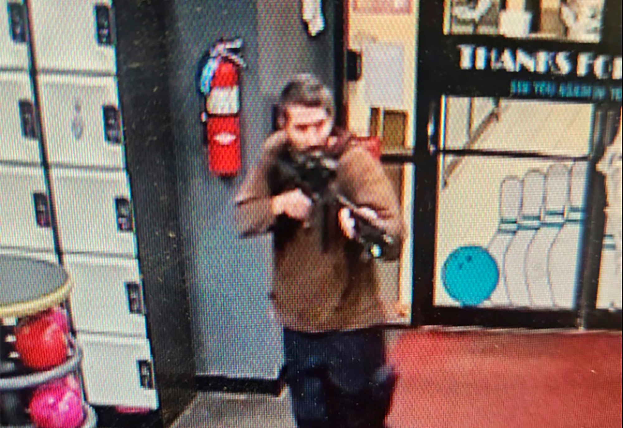 A gunman enters Sparetime Recreation in Lewiston, Maine, on Wednesday