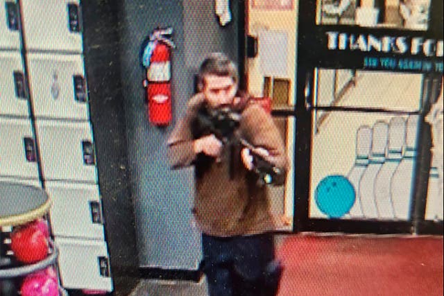 <p>A gunman enters Sparetime Recreation in Lewiston, Maine, on Wednesday</p>