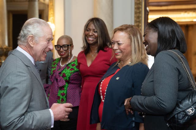 <p>The King greets Black Powerlist guests at a Buckingham Palace reception</p>