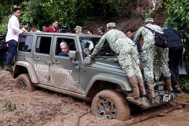 <p>Mexican President Andres Manuel Lopez Obrador’s vehicle is stuck in mud during a visit to the Kilometro 42 community, near Acapulco, Guerrero State, Mexico, after the passage of Hurricane Otis, on October 25, 2023</p>