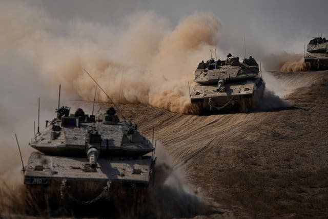 <p>Israeli tanks head towards the Gaza Strip border in southern Israel </p>