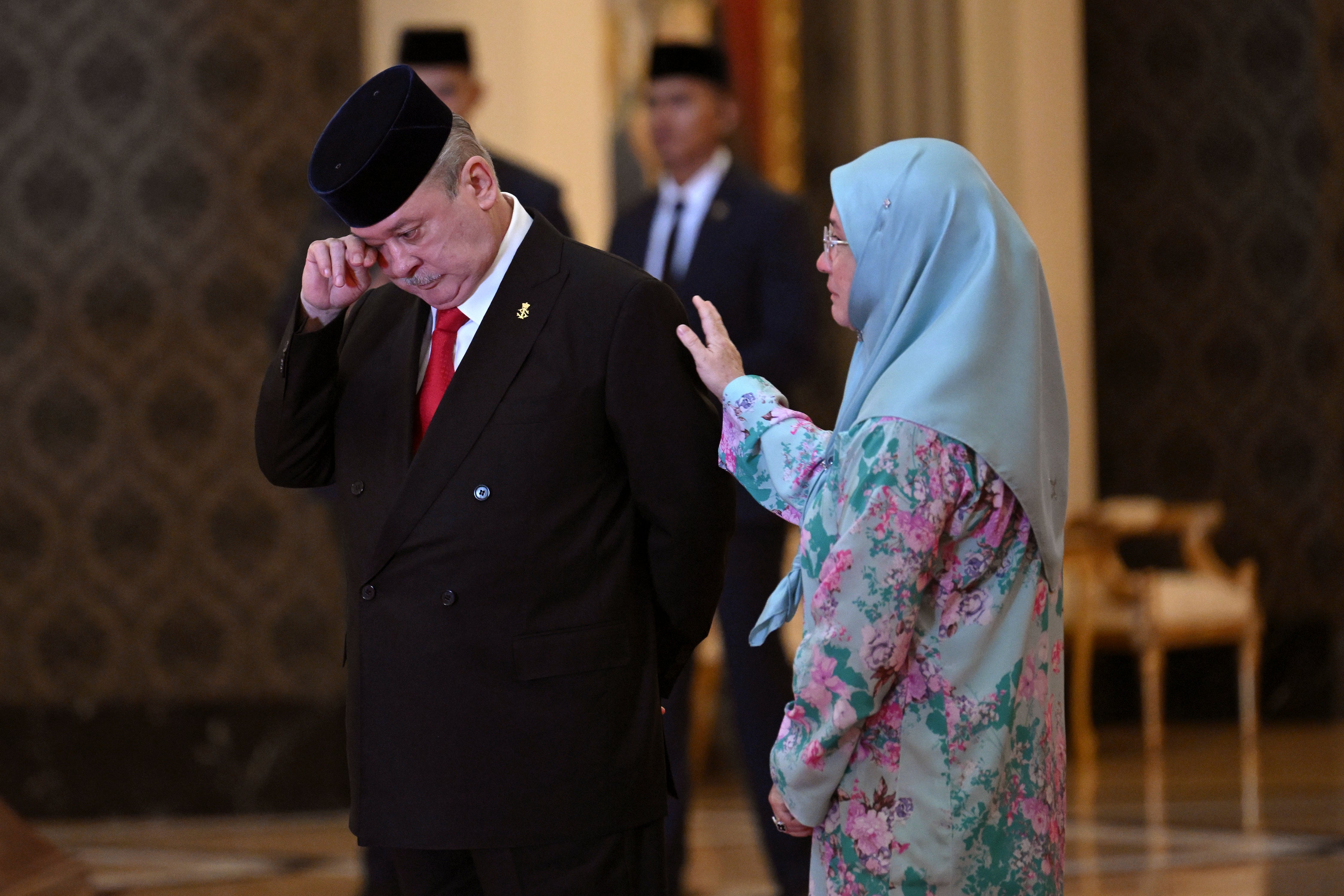 Sultan Ibrahim Iskandar of Johor, left, wipes his tears next to his sister Malaysia’s Queen Tunku Azizah Aminah Maimunah Iskandariah after the election for the next Malaysian king at the National Palace in Kuala Lumpur Friday, 27 October 2023
