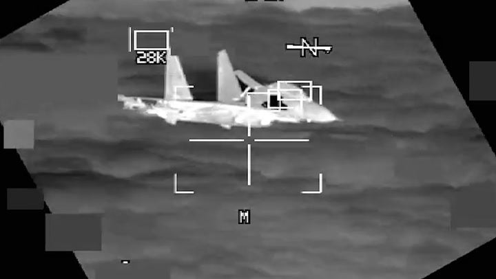 <p>Moment Chinese fighter jet flies within 10 feet of American B-52 bomber.</p>