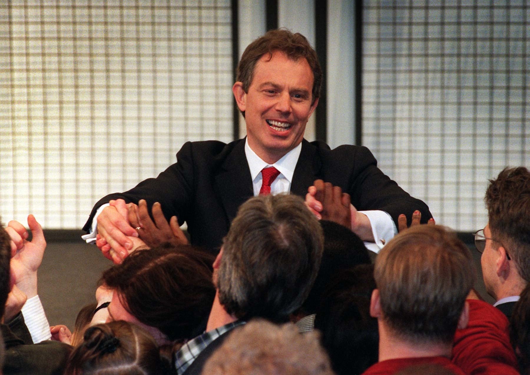 Tony Blair greeting a roaring crowd on the South Bank after his landslide victory