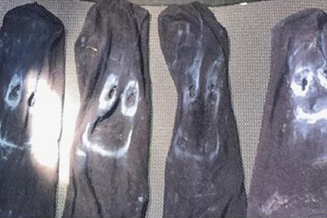 <p>Some of the masks recovered from Joshua Hunt’s van and home</p>