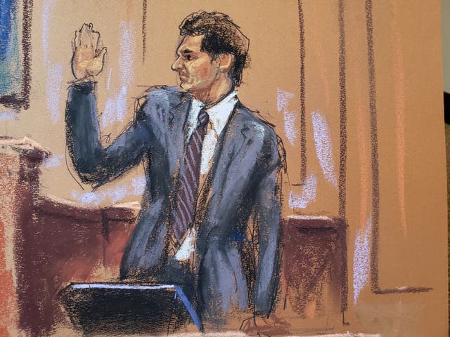 <p>Sam Bankman-Fried is sworn in as he testifies in his fraud trial over the collapse of the bankrupt cryptocurrency exchange FTX, at federal court in New York on 27 October</p>