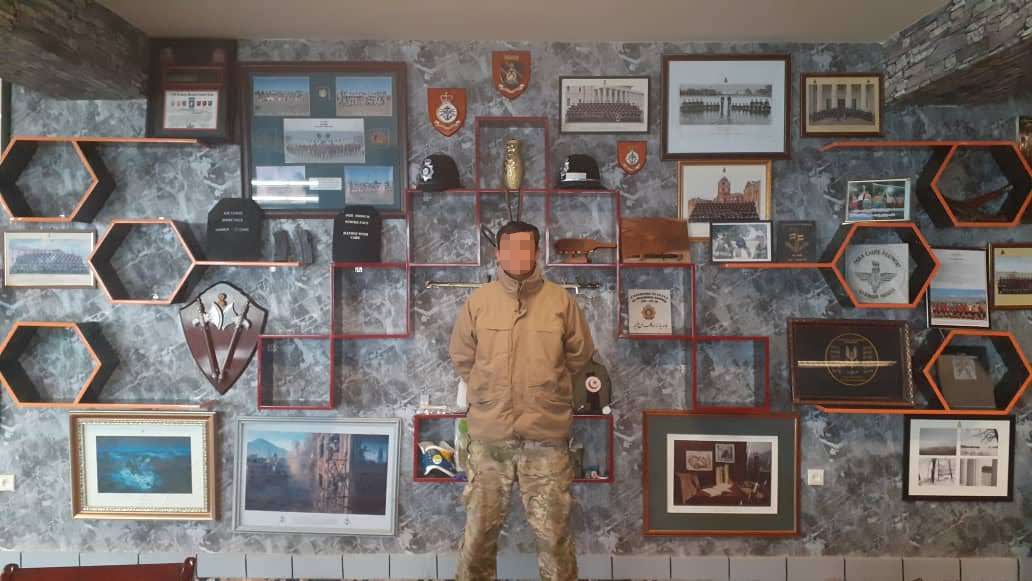An Afghan special forces soldier stands in a meeting room used by Afghan and British mentors
