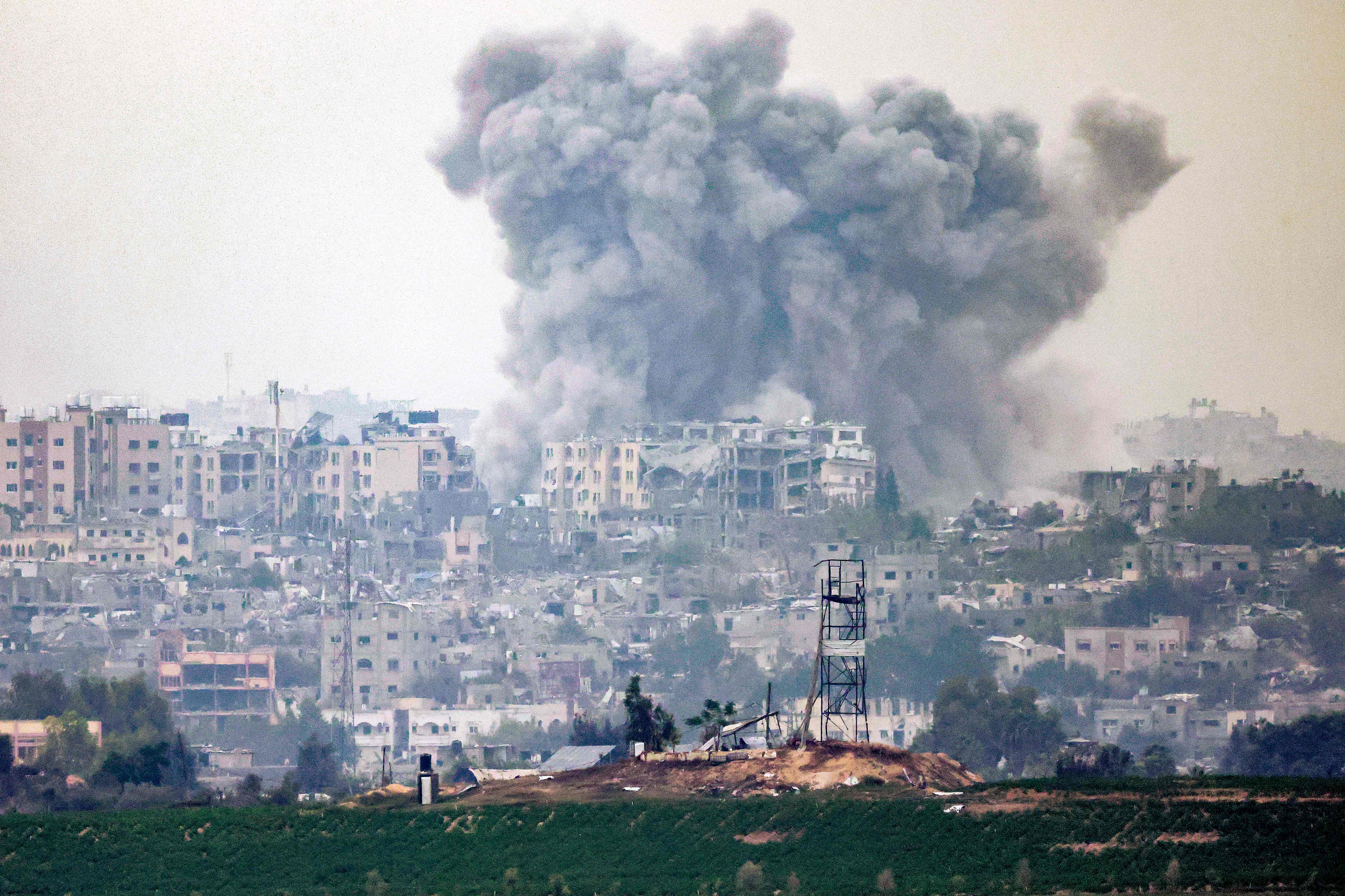 A smoke plume following Israeli bombardment over the northern Gaza Strip earlier on Friday