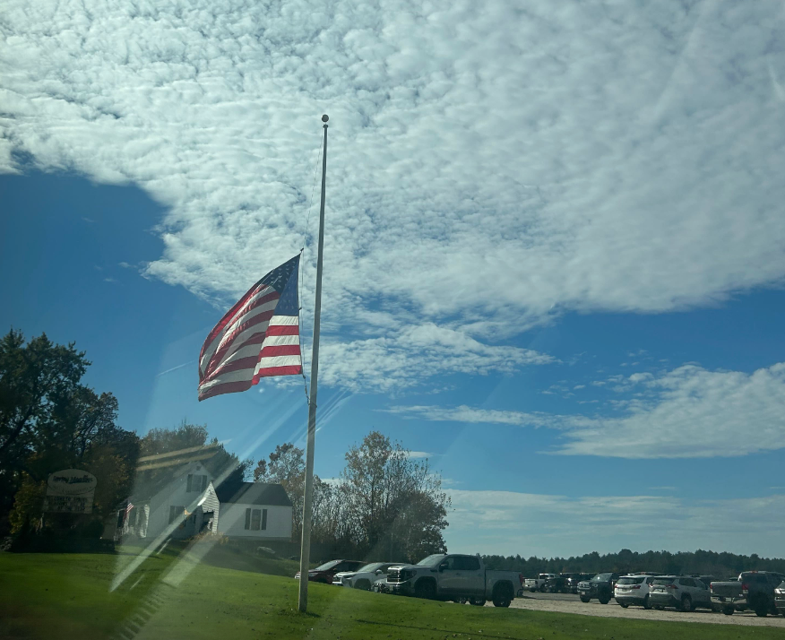 A flag at half-mast in Lewsiton, where a gunman killed 18 people and injured a dozen on Wednesday night
