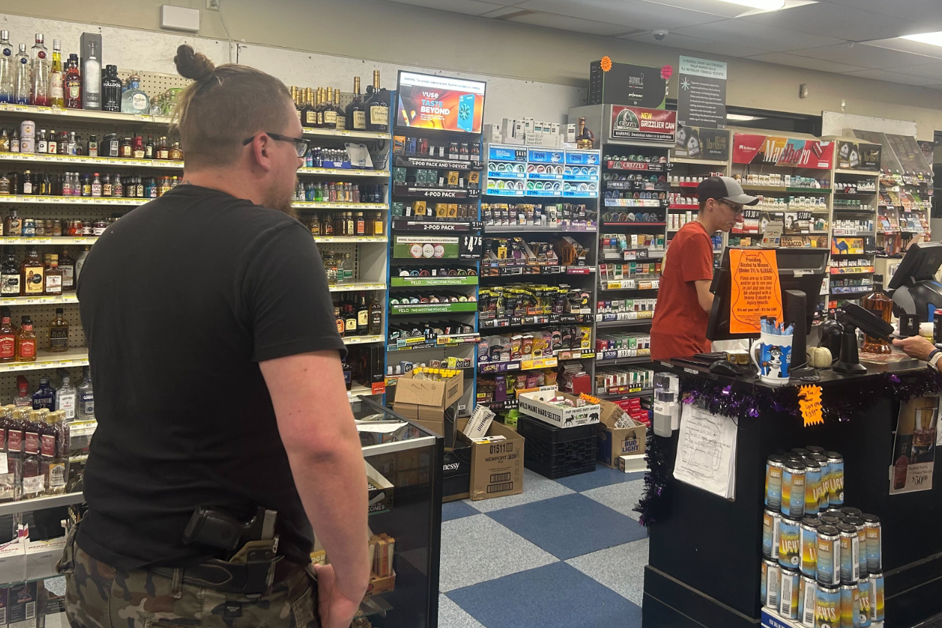 Steve Demele made a stop at the Roopers Beverage & Redemption carrying a gun in his holster