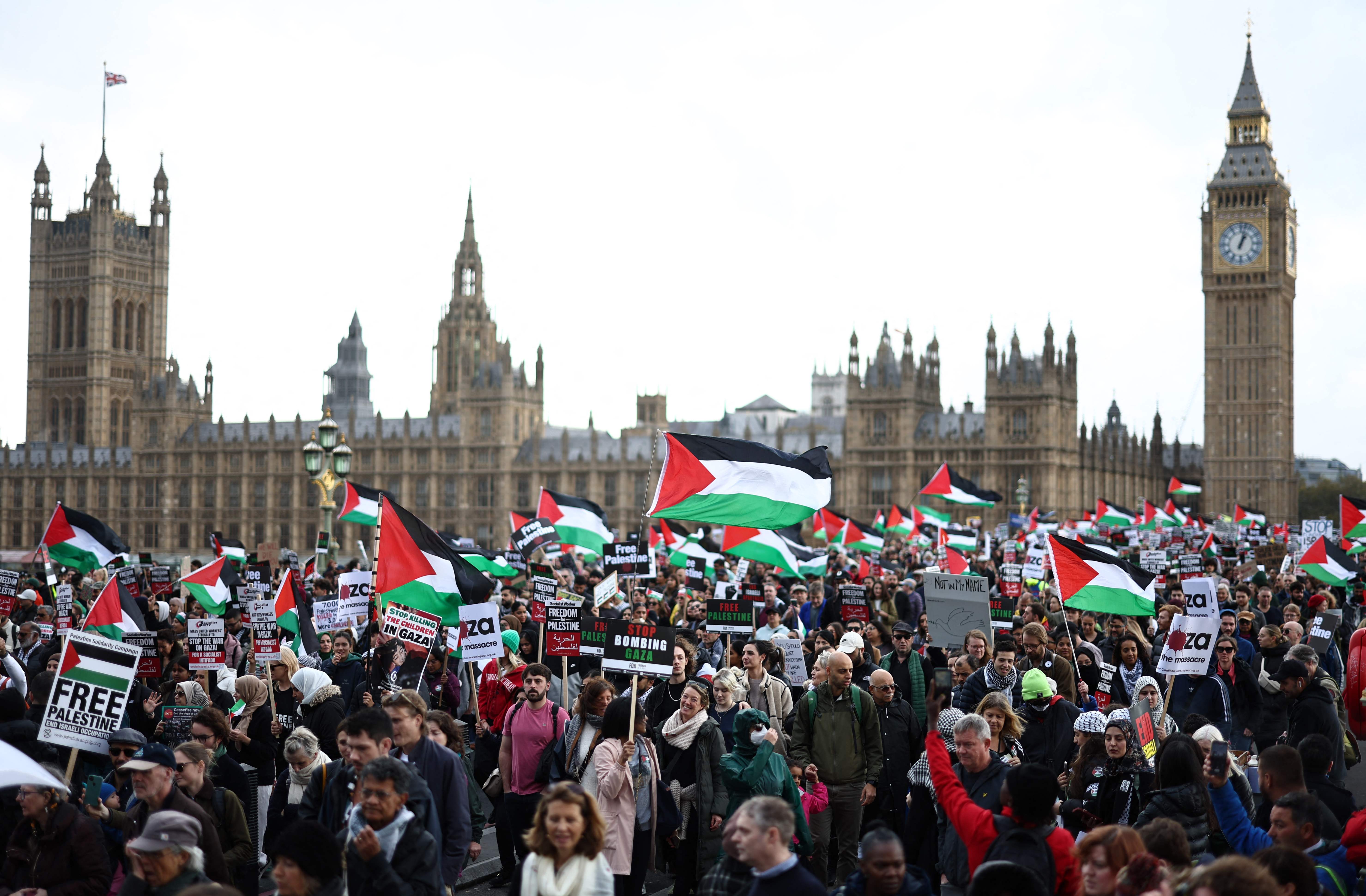 Protesters on Westminster Bridge as thousands in cities around the world took to streets to oppose the war