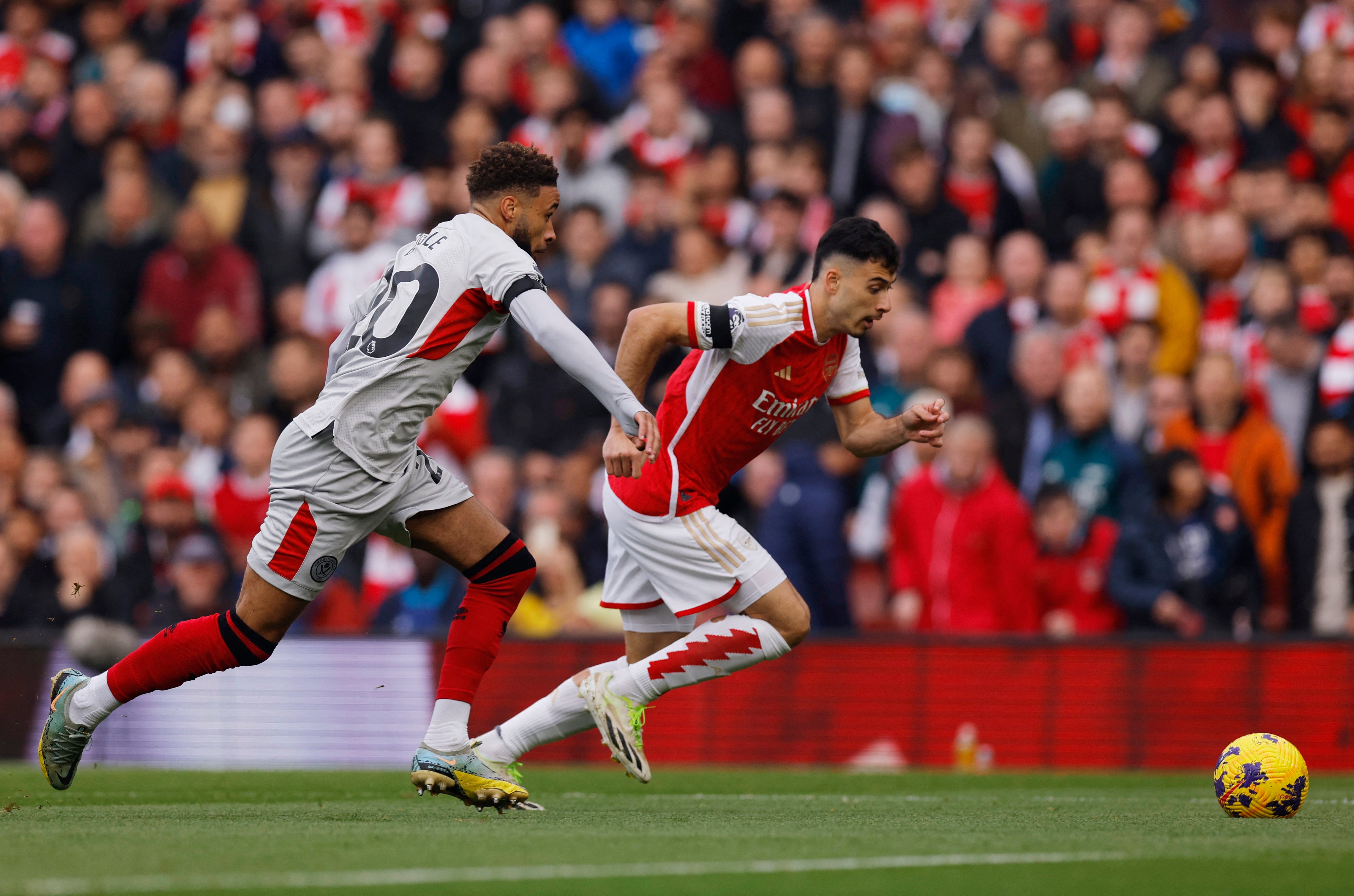 <p>Arsenal’s Gabriel Martinelli dribbles with the ball </p>