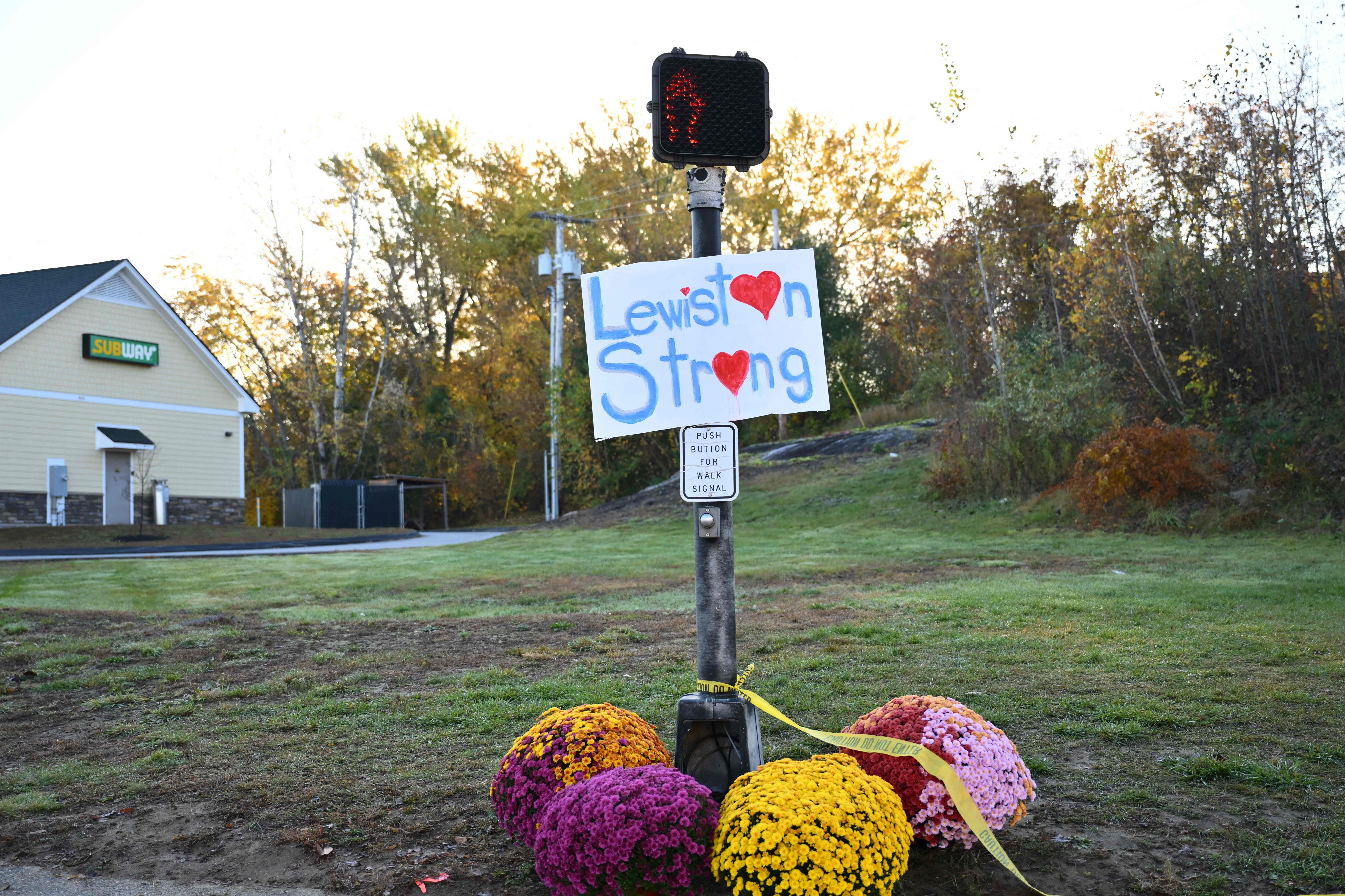 <p>A sign reading ‘Lewiston Strong’ stands in the Maine community scarred by America’s latest mass shooting</p>