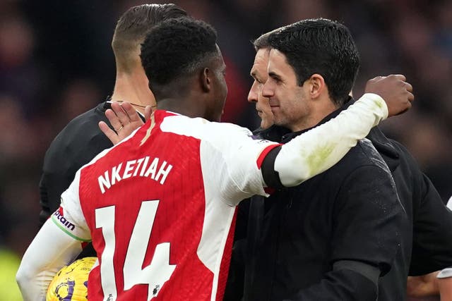 Eddie Nketiah hugs Arsenal manager Mikel Arteta (John Walton/PA)
