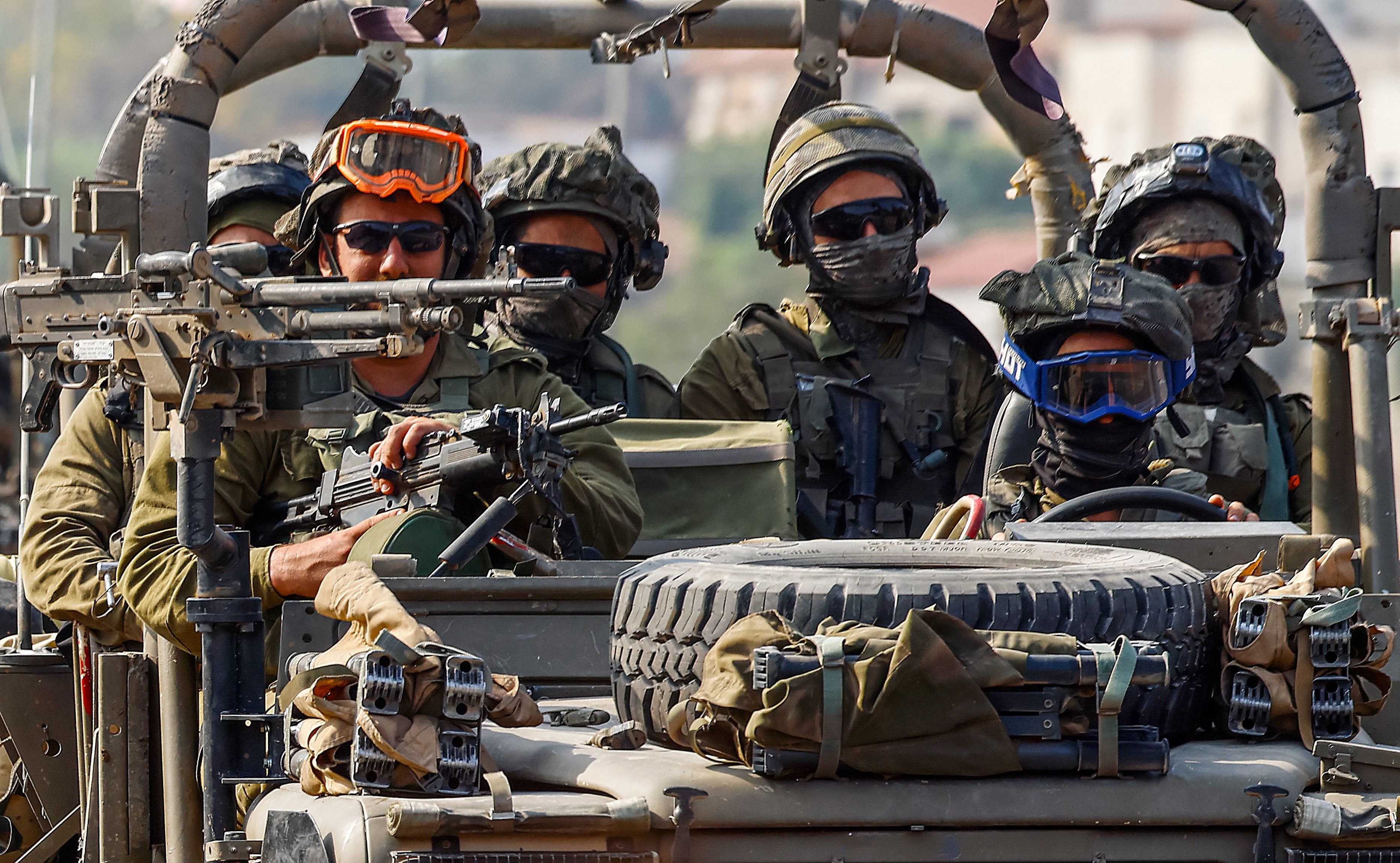 Israeli soldiers patrol on a street in Sderot, near the border with Gaza