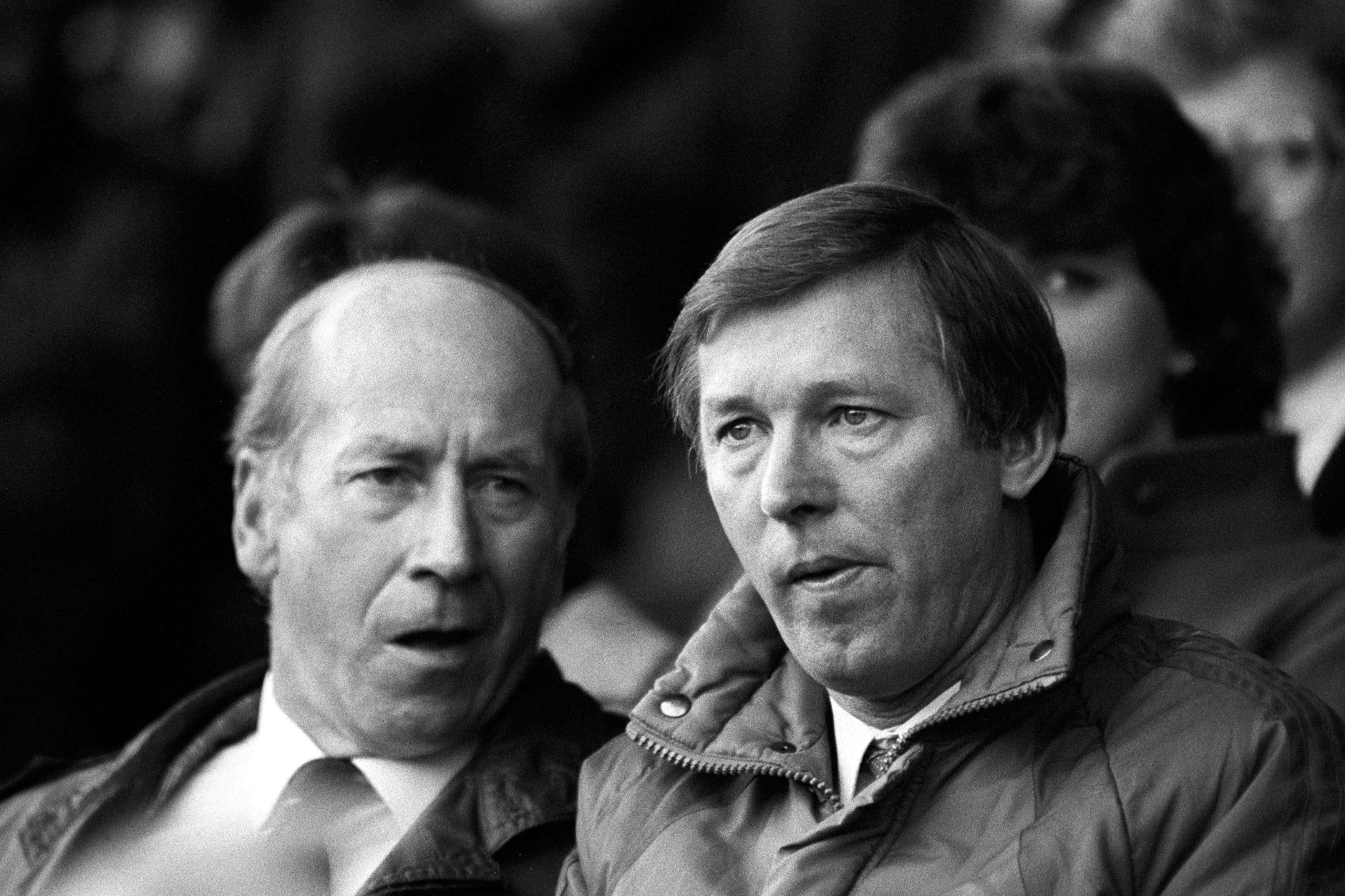 Sir Alex Ferguson (right) has described Sir Bobby Charlton (left) as a “tower of strength” (PA)