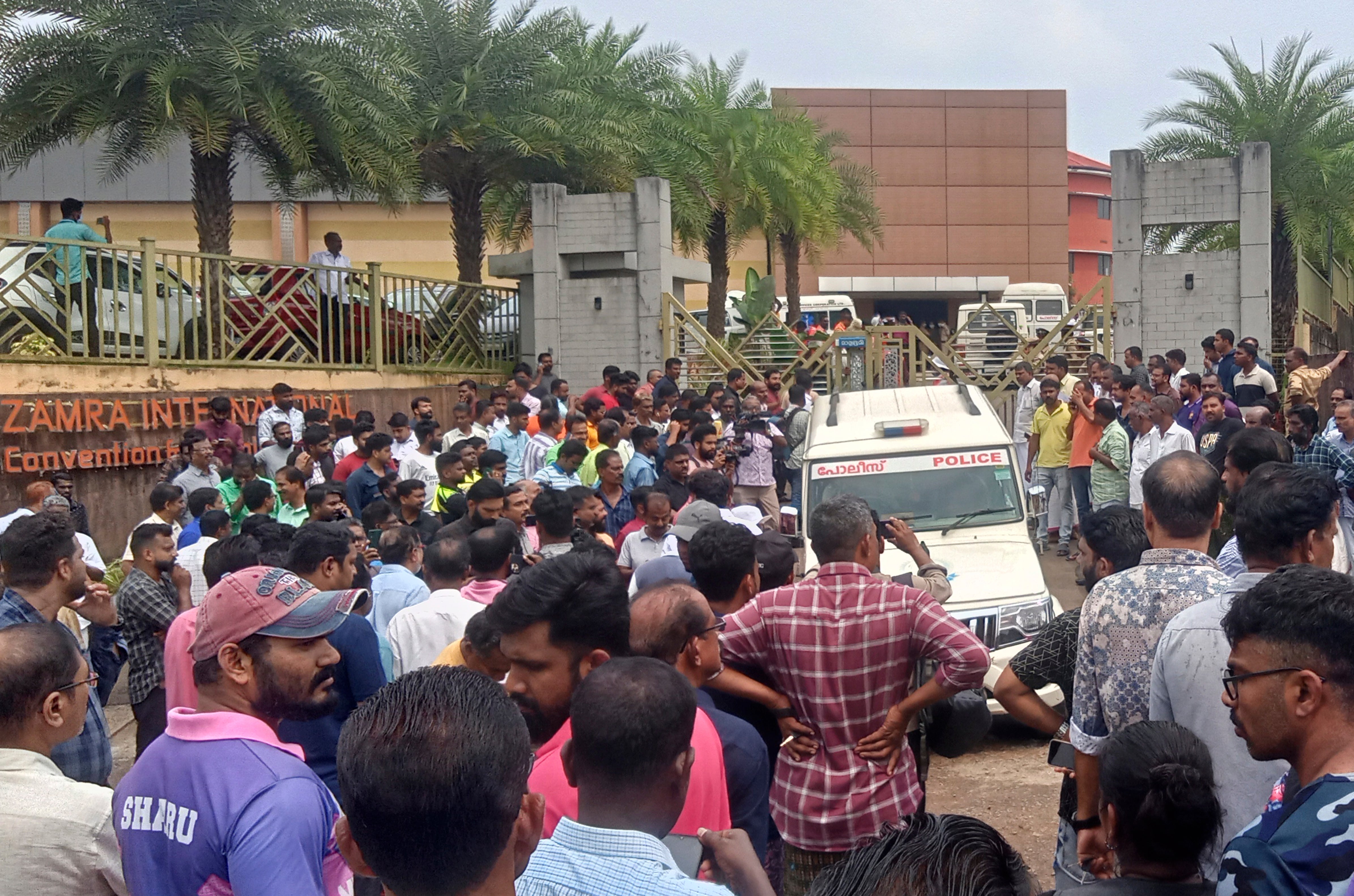 People gather outside following a blast at the Zamra convention center in Kalamassery, a town in Kochi, southern Kerala state, India, Sunday, 29 Oc, 2023