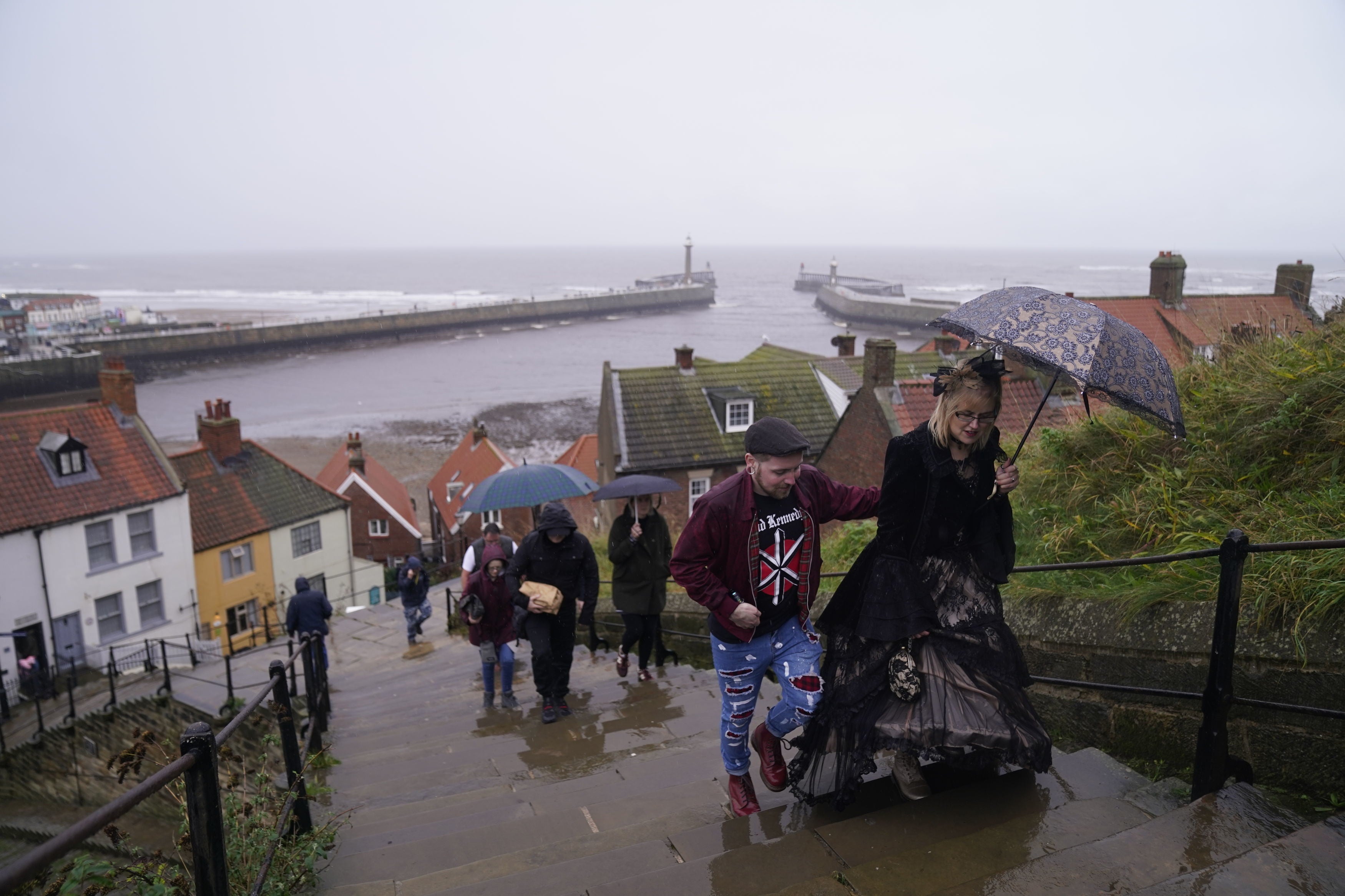 <p>People braving the rain as they attend the Whitby Goth Weekend in Whitby, Yorkshire.</p>