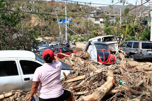<p>Damaged vehicle and downed trees following Hurricane Otis in Acapulco, Mexico </p>