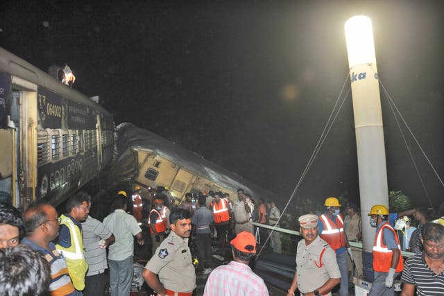 <p>File. Rescuers and others stand after two passenger trains collided in Vizianagaram district, Andhra Pradesh state, India, Sunday, 29 October 2023</p>