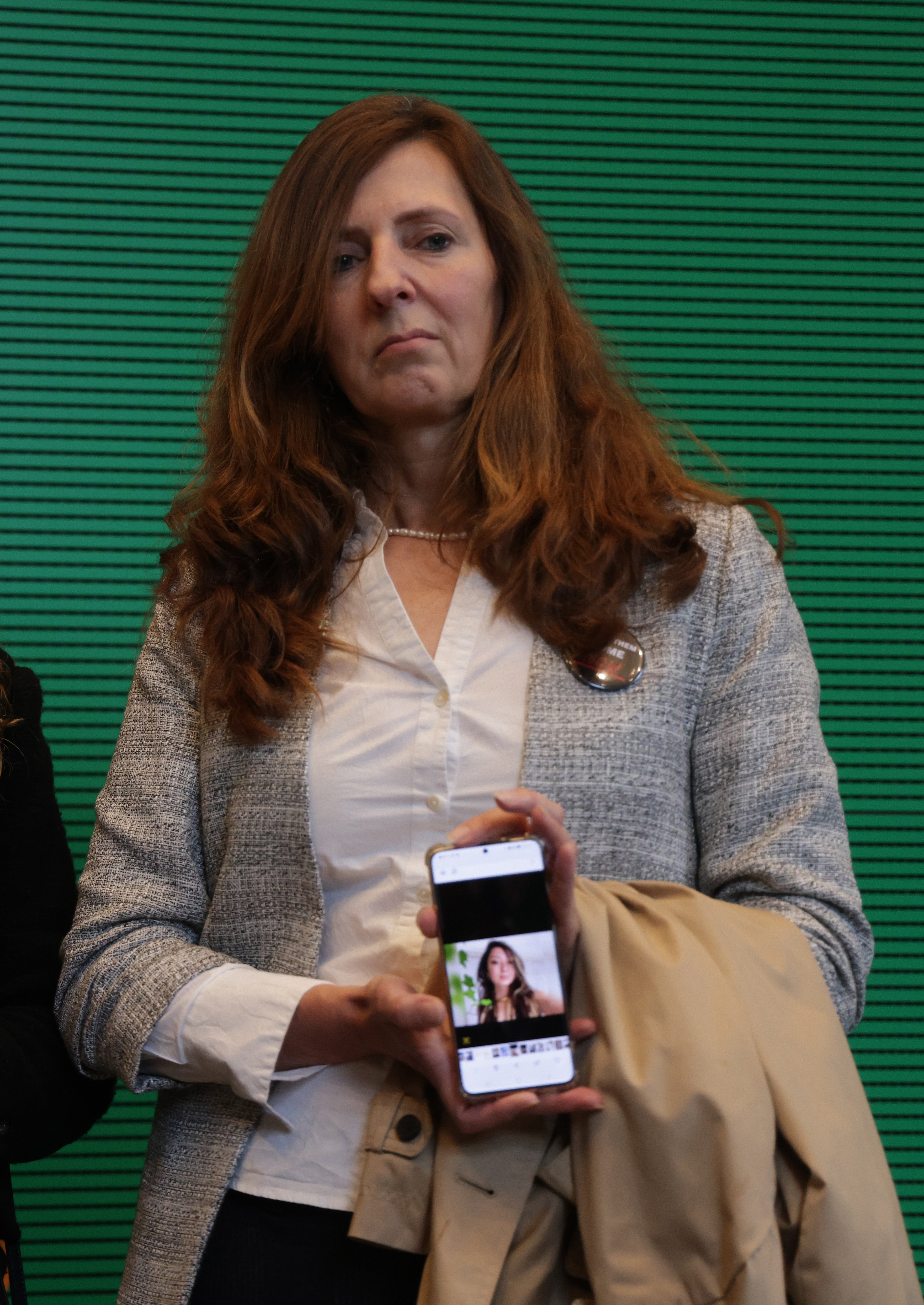 Ricarda Louk, mother of Gaza hostage Shani Louk, holds a portrait of Shani