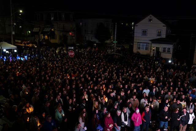 <p>People gather at a vigil for the victims of Wednesday’s mass shootings</p>