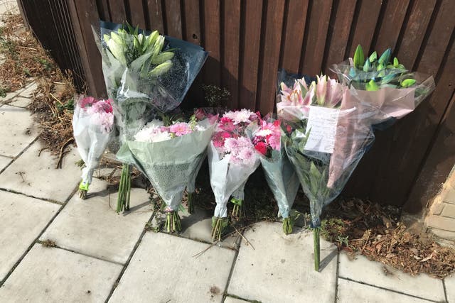 Floral tributes at the scene in Kirkstall Gardens, Streatham Hill, south London, where rapper Chris Kaba was shot (Andrew Quinn/PA)