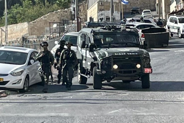 Israeli security forces outside the home of the family