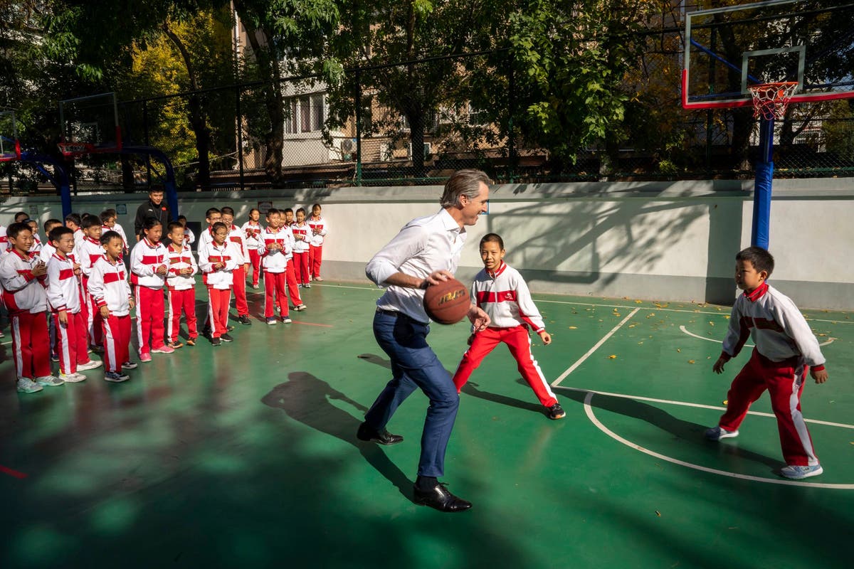 California's Newsom plays hardball in China, collides with student during schoolyard basketball game