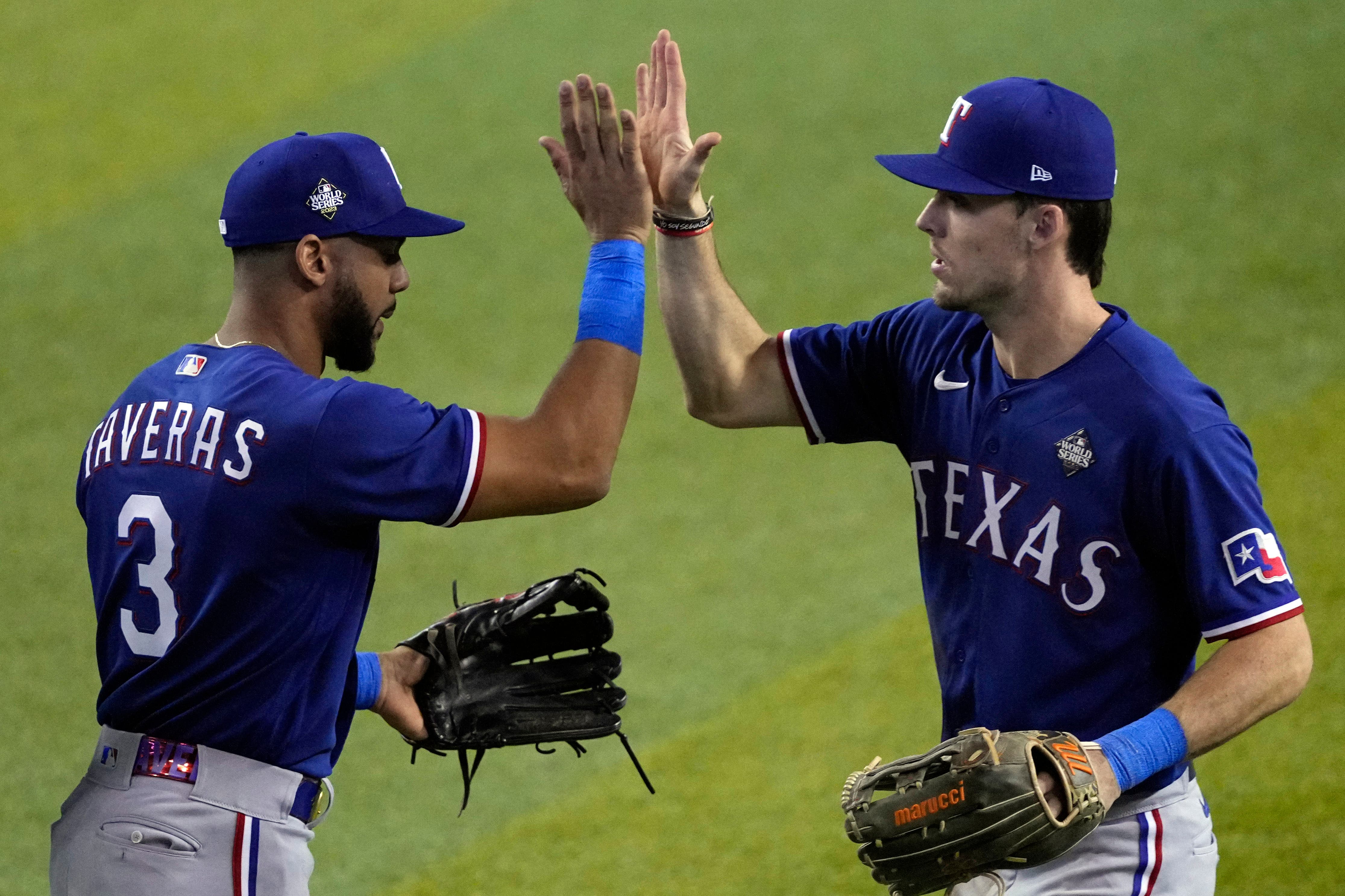 Texas Rangers’ Leody Taveras (3) and Evan Carter celebrate victory (Ross D Franklin/AP)