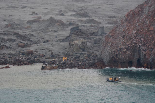 <p>Emergency workers recover bodies from White Island on Dec. 13, 2019, after a volcanic eruption in Whakatane, New Zealand</p>