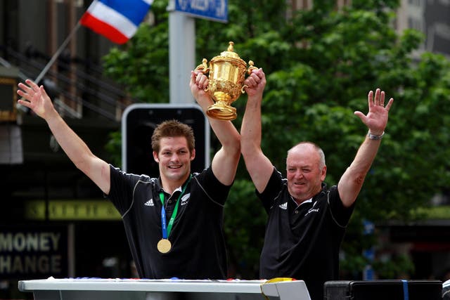 Graham Henry, right, and New Zealand captain Richie McCaw lift the Rugby World Cup in 2011 (David Davies/PA)
