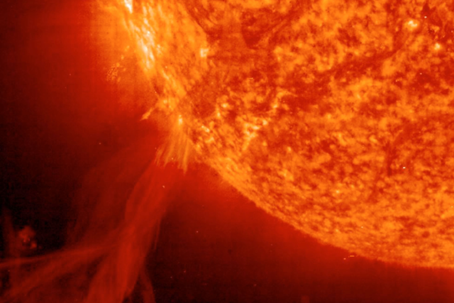 <p>Astronomers at the Solar & Heliospheric Observatory (SOHO) captured this image of a solar prominence erupting from the surface of the Sun on October 25, 2002. </p>
