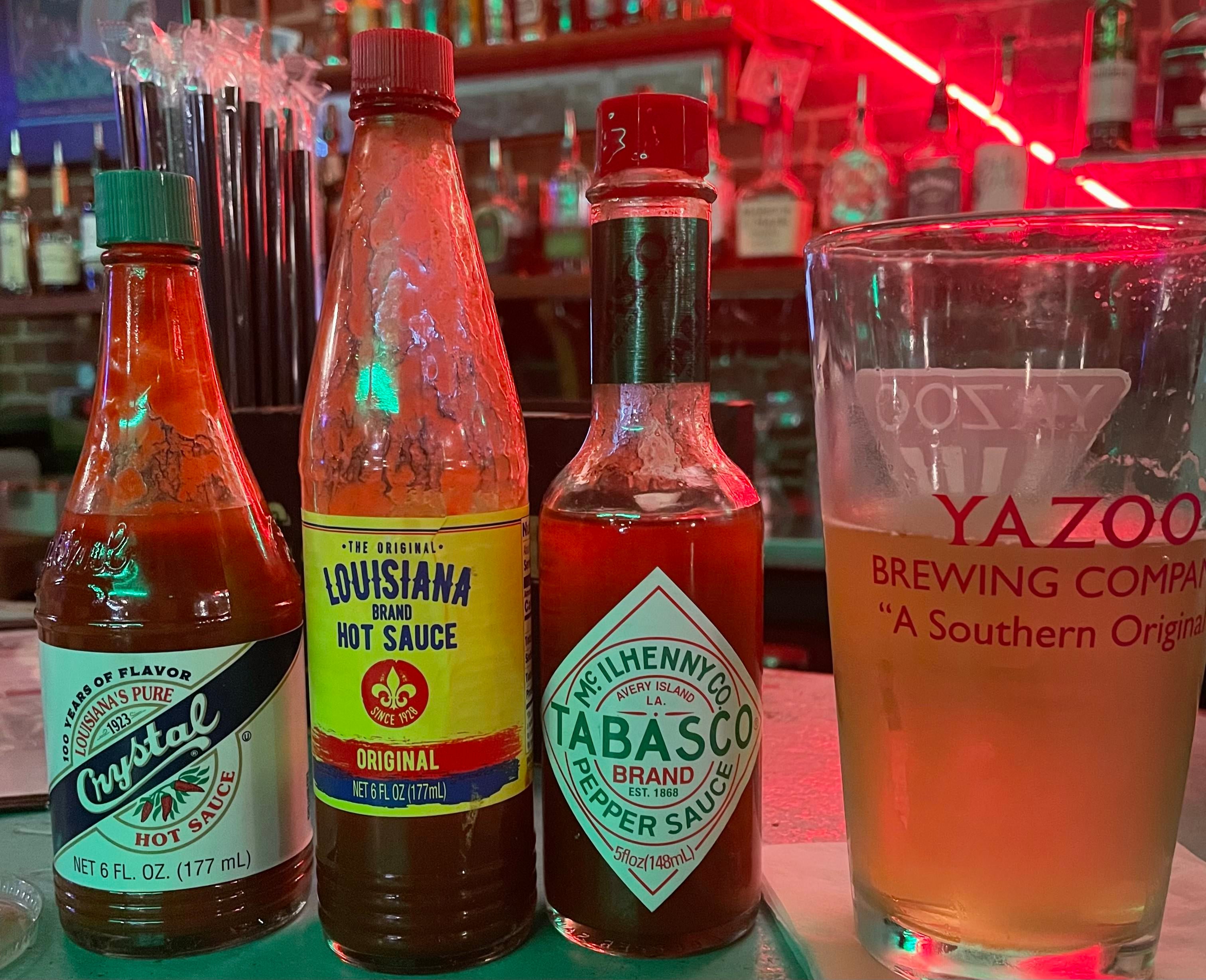 <p>Every Louisiana bar has a hot sauce selection</p>