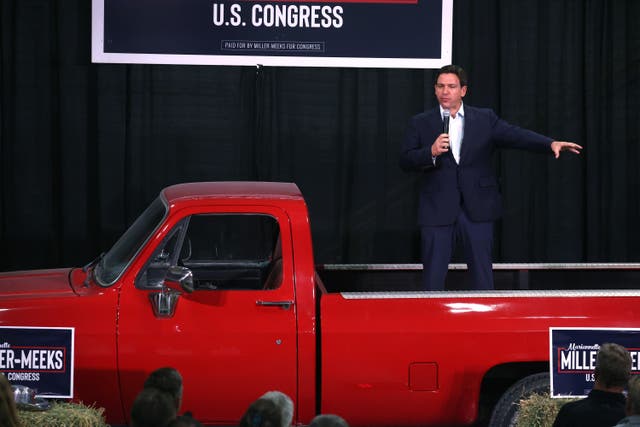 <p>Republican presidential candidate Florida Governor Ron DeSantis speaks to guests at the third annual MMM Tailgate celebration hosted by U.S. Rep. Mariannette Miller-Meeks (R-IA) on October 20, 2023 in Iowa City, Iowa</p>