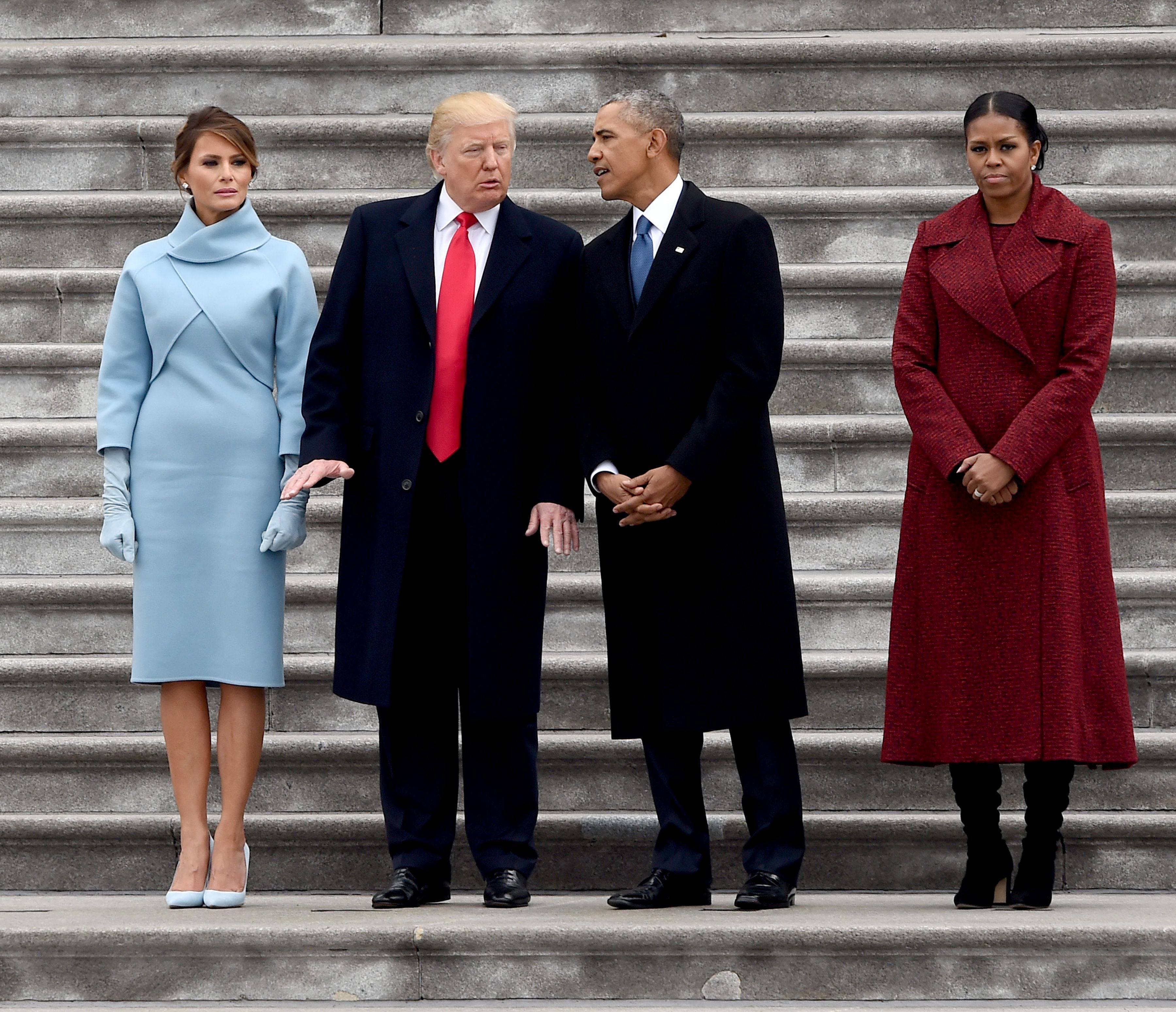 First Lady Melania Trump, President Donald Trump former President Barack Obama and Michelle on the East front steps of the US Capitol after inauguration ceremonies on January 20, 2017 in Washington, DC