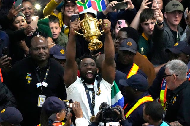 South Africa captain Siya Kolisi showed off the Webb Ellis Cup during a triumphant homecoming (Themba Hadebe/AP)