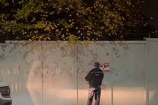Investigation under way after police officer seen removing Hamas hostage posters