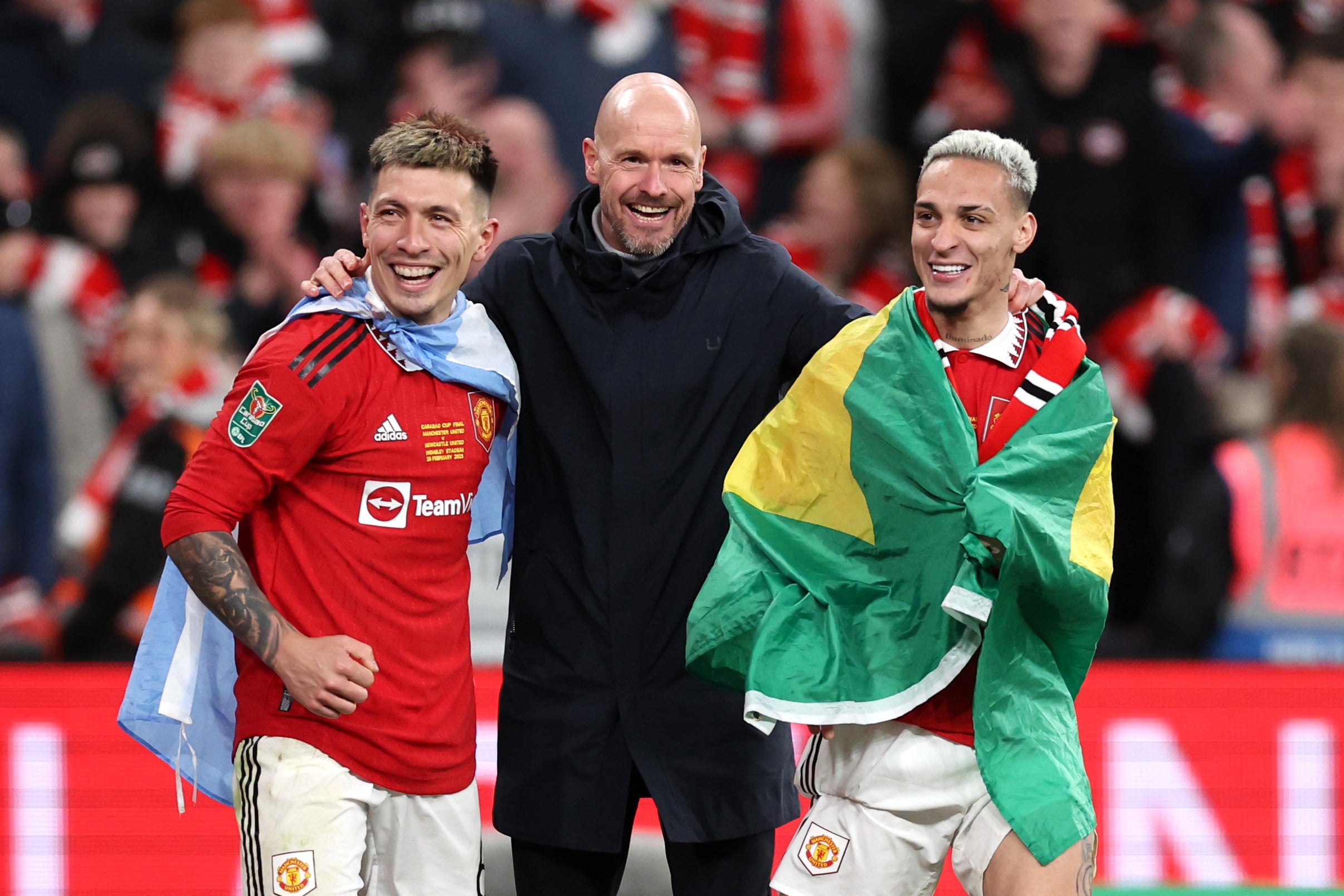 Ten Hag celebrates with Martinez and Antony on the Wembley pitch