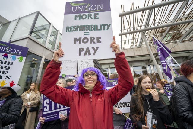 School support staff members of Unison during a rally outside the Scottish Parliament in Holyrood (Jane Barlow/PA)