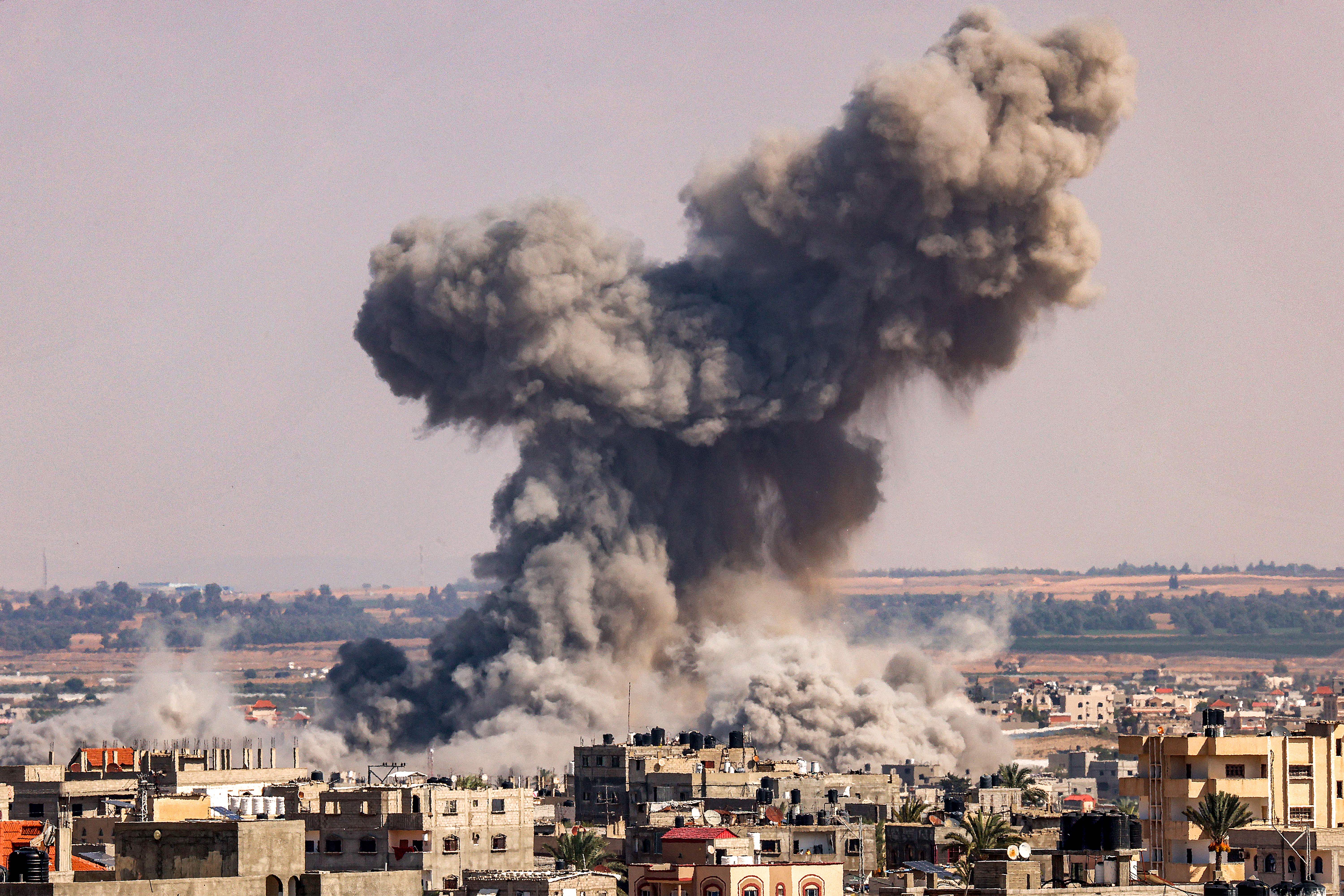 A smoke plume erupts during Israeli bombardment in Rafah in the southern of Gaza Strip