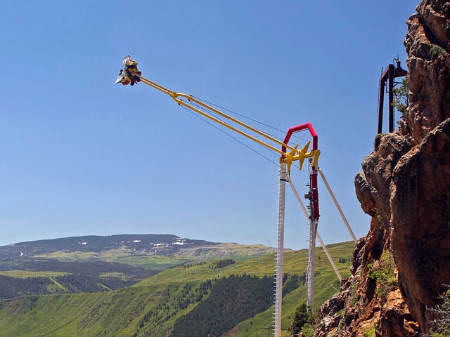 <p>People ride the Giant Canyon Swing at Glenwood Caverns Adventure Park in Glenwood Springs, Colo., June 10, 2011.</p>