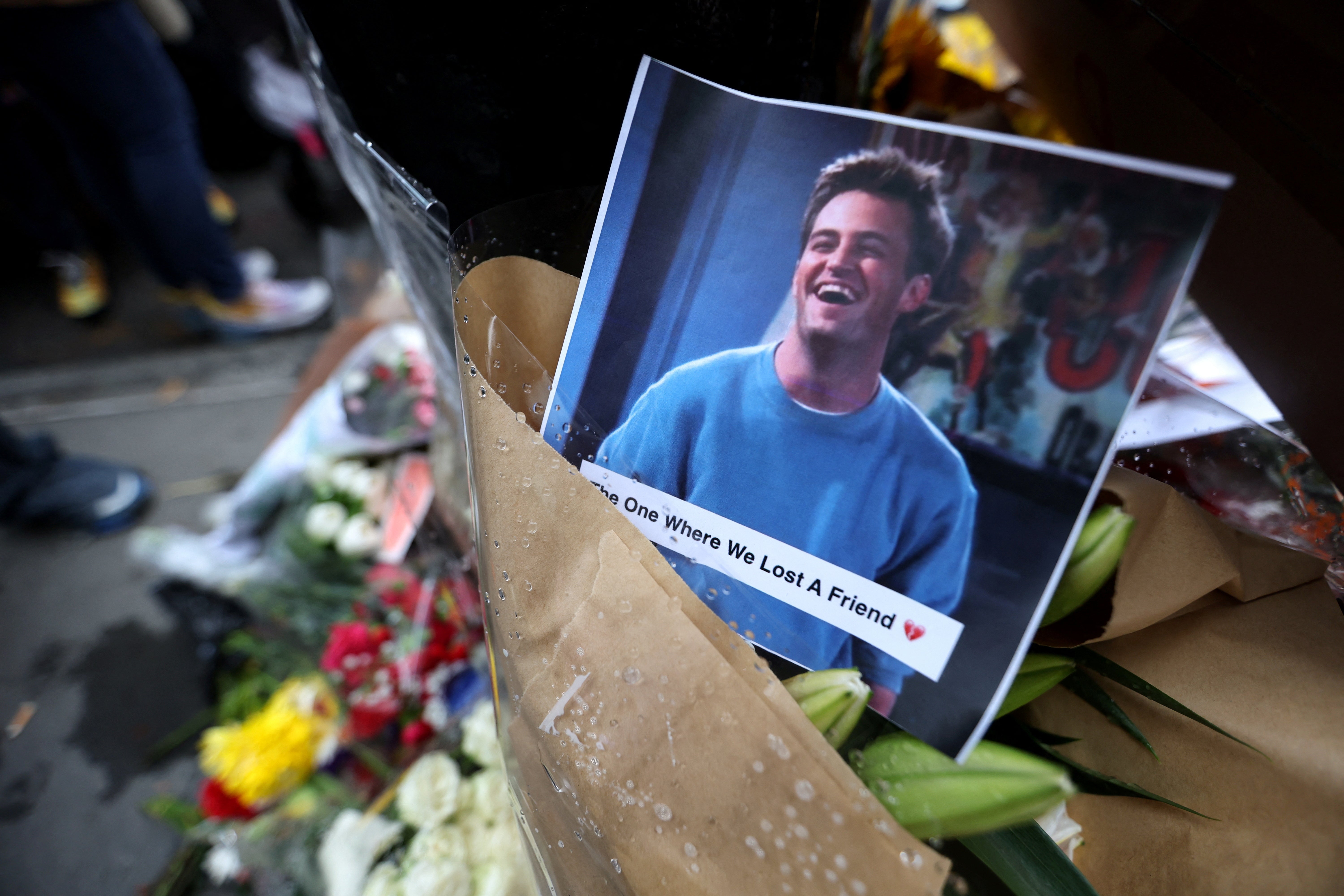 A makeshift memorial for actor Matthew Perry