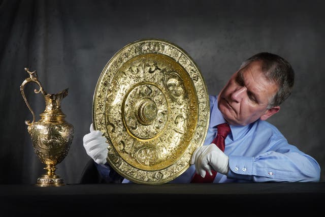 Curator Dr Godfrey Evans with the Panmure ewer and basin (Stewart Attwood/PA)