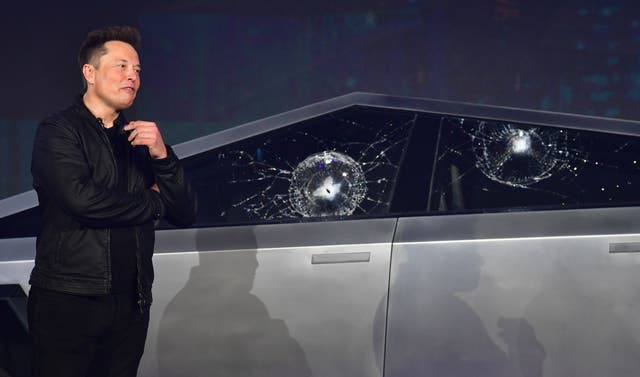 <p>Tesla co-founder and CEO Elon Musk verbally reacts in front of the newly unveiled all-electric battery-powered Tesla Cybertruck with broken glass on windows following a demonstation that did not go as planned on November 21, 2019 at Tesla Design Center in Hawthorne, California. </p>