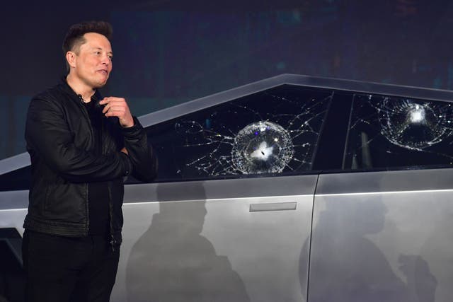 <p>Tesla co-founder and CEO Elon Musk verbally reacts in front of the newly unveiled all-electric battery-powered Tesla Cybertruck with broken glass on windows following a demonstation that did not go as planned on November 21, 2019 at Tesla Design Center in Hawthorne, California. </p>
